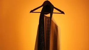 Emirati jubbah showcasing intricate design and craftsmanship details for premium men's wear.